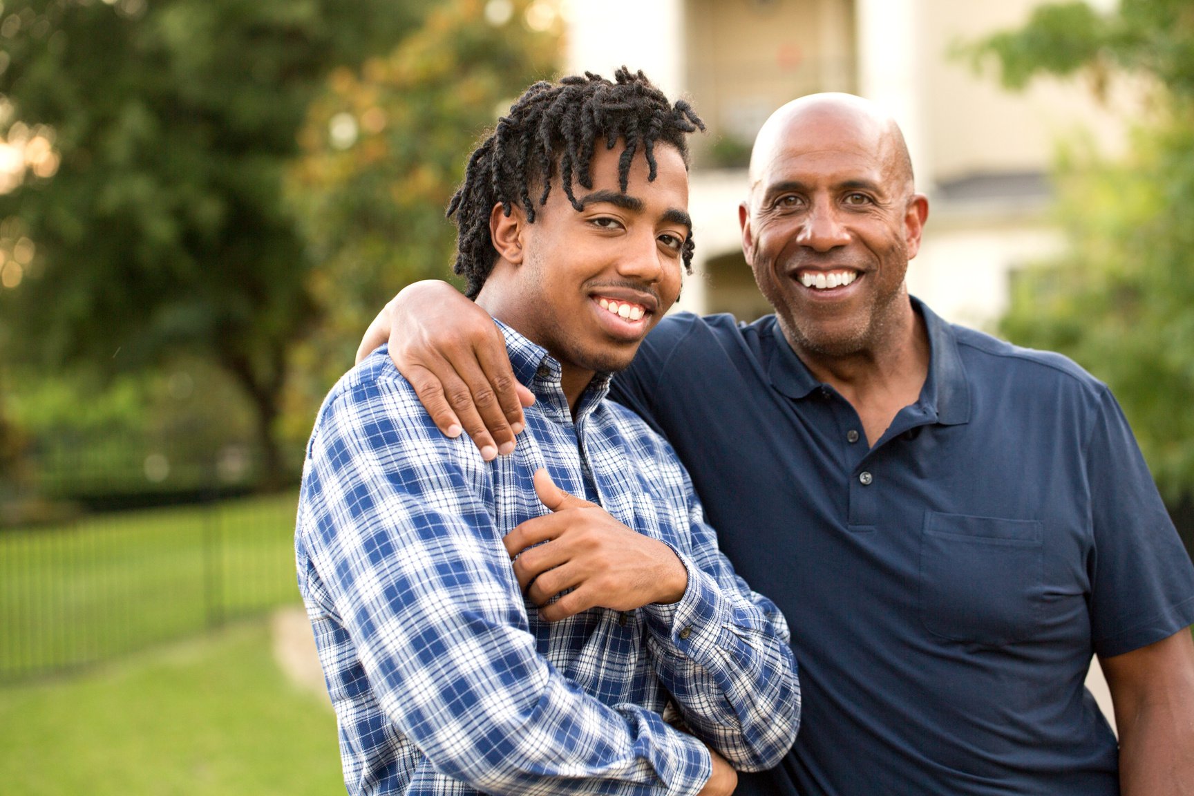 African American father and his adult son.